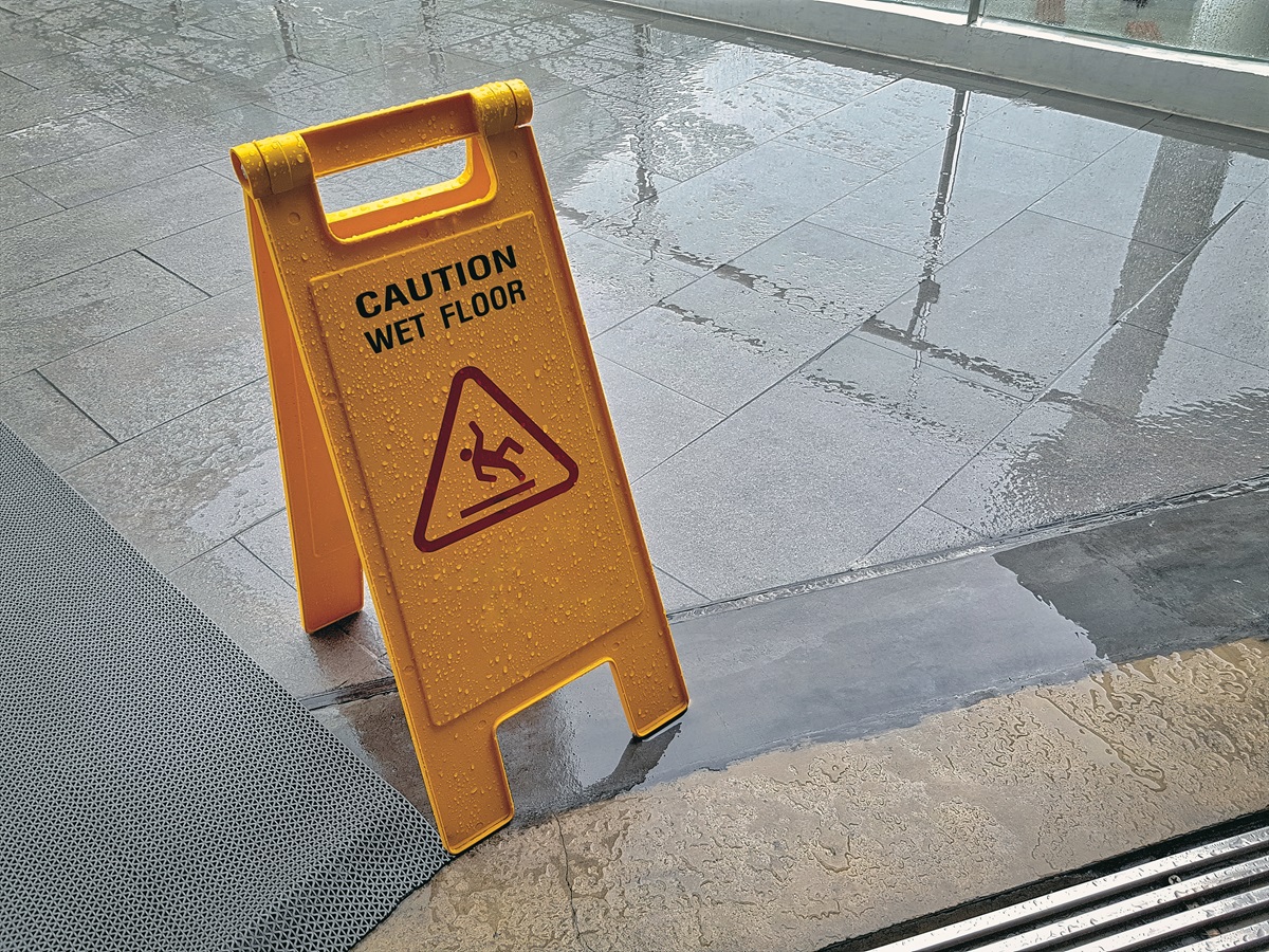 A wet floor sign our on a wet floor